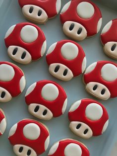 there are many decorated cookies in the shape of mushrooms