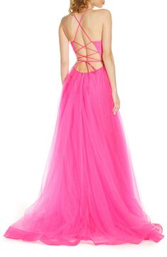 Ethereal tulle in a vivid shade of pink makes this floor-sweeping gown one that will never sit out a danceable song. Style Name:La Femme Neon Light Tulle Gown. Style Number: 5982252. Pink Backless Gown For Prom, Pink Backless Gown For Prom Season, Pink Fitted Bodice Backless Gown, Pink Backless Gown With Fitted Bodice, Pink Ball Gown With Sweep Train For Gala, Pink Floor-length Gown With Corset Back, Pink Ball Gown With Sheer Bodice For Prom, Pink Tulle Ball Gown With Corset Back, Prom Gown With Lace-up Back And Floor Length