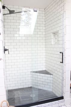 a walk in shower sitting inside of a bathroom