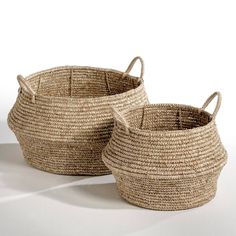 two woven baskets sitting next to each other