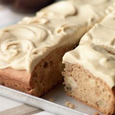 a cake with frosting sitting on top of a pan