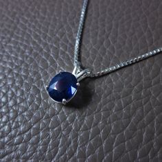 "Genuine Royal Blue Sapphire Pendant Necklace DESCRIPTION This is a large, gorgeous dark blue Sapphire gemstone. Sturdily set in the precious metal of your choosing and suspended from a sparkling Italian diamond-cut chain of matching precious metal. Simply Elegant and Classy. This deep ocean blue Sapphire can be seen sparkling from across the room. * Please allow 1-2 weeks processing time for 14k Gold Options of this necklace as it will be specially made for you. DETAILS {You will receive the Sa Blue Gemstone Necklace With Lab-created Sapphire, Blue Lab-created Sapphire Gemstone Necklaces, Blue Sapphire Round Pendant Jewelry, Sapphire Pendant Necklace, Necklace Sapphire, Blue Sapphire Pendant, Sapphire Necklace Pendants, Blue Sapphire Necklace, Sapphire Solitaire