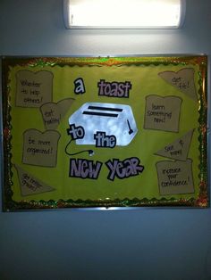 a bulletin board that has been decorated with toast to the new year written on it