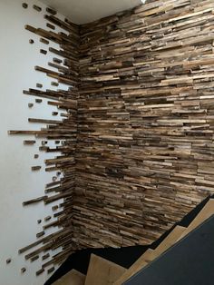 a wall made out of wooden planks in a room