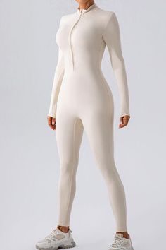 Half Zip Mock Neck Active Jumpsuit - Active Set - FITGGINS Sporty High Stretch Unitard With Thumbholes, Sporty High-stretch Unitard With Thumbholes, High Stretch Sporty Unitard With Thumbholes, High Neck Athleisure Activewear For Gym, Sports Long Sleeve Jumpsuit, Sporty Long Sleeve Compression Unitard, High Neck Solid Activewear For Workout, White Athleisure Bodysuit For Yoga, Solid High Neck Activewear For Workout