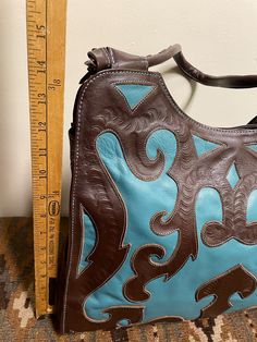 Leaders in Leather Beautifully Cutout Tooled Shoulder Bag - Etsy Turquoise Hand Tooled Rectangular Shoulder Bag, Turquoise Hand Tooled Shoulder Bag For Travel, Turquoise Hand Tooled Bag, Blue Hand Tooled Rectangular Shoulder Bag, Blue Rectangular Hand Tooled Shoulder Bag, Handmade Turquoise Shoulder Bag, Hand Tooled Blue Bags For Daily Use, Hand Tooled Blue Bag For Daily Use, Blue Hand Tooled Bags For Daily Use