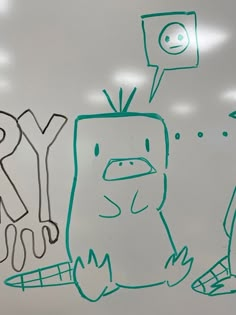 a drawing of a cartoon character is drawn on a whiteboard