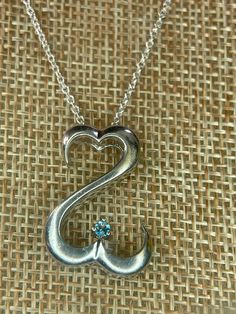 Pretty sterling and blue topaz open double heart pendant. Marked TJ 925. 5 grams on a 20 inch Italy 925 chain. Mint condition Jane Seymore, Arm Bracelets Upper, Arm Bracelets, Marcasite Ring, Garnet Bracelet, Double Heart, Open Heart, Pandora Bracelet, Blue Topaz