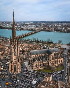 an aerial view of a large cathedral in the middle of a city with lots of traffic