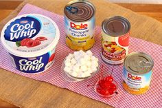 the ingredients to make an ice cream dessert are displayed on a pink and white towel