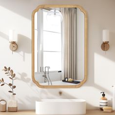 a bathroom with a sink, mirror and window