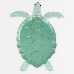 a paper plate with a green turtle on it's back and gold trim around its neck