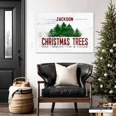 a christmas tree with the words jackson on it and a chair in front of it