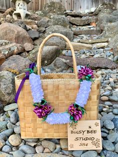 Handmade satin ribbon lei with beautiful white plumeria sections accented with purple anthurium flowers. Lei section measures 36 inches in total length. Ends are capped with kukui nuts and adjustable tie. Perfect to give at graduation or to wear at any special event. Lei Purse, Plumeria Ribbon Lei, Anthurium Flower, Ribbon Lei, Kukui Nut, Floral Ribbon, Royal Blue And Gold, Organza Ribbon, Lace Ribbon