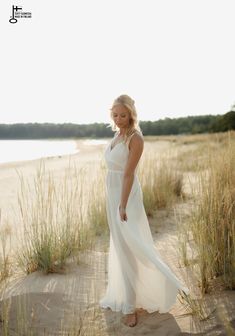 SUNRISE White flowy dress with straps | Maternity dress for photoshoot and wedding | Elopement boho dress for photography |Jenny Aarrekangas SUNRISE is a white flowy romantic dress for photography and boho weddings.  It is the perfect summer dress for maternity photography.  When shooting the maternity dress in backlight, you can see the beautiful silhouette through the fabric. It is also a lovely dress for an elopement photoshoot on the beach or as a boho dress for special occassions. The spagh Flowy Chiffon Maxi Dress For Beach Wedding, Ethereal White Maxi Dress For Wedding, Ethereal Summer Wedding Gown, Ethereal White Wedding Maxi Dress, Flowy Maxi Dress For Wedding Night, Elegant Summer Beach Wedding Dress, Chiffon Maxi Dress For Beach Wedding, Flowy Floor-length Maxi Dress For Beach Wedding, Summer Beach Wedding Maxi Gown