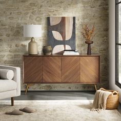 a living room with stone walls and furniture