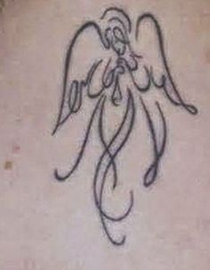 an angel tattoo on the back of a woman's neck