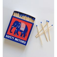 matches are placed next to an elephant match box