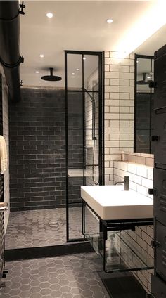 an image of a bathroom setting with black and white tiles