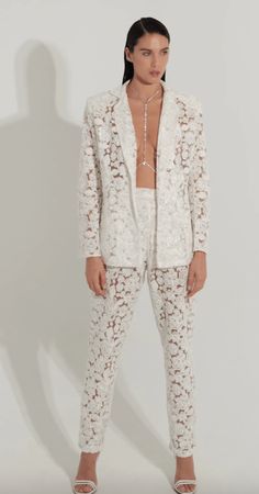 Nonchalant Pixie Lace Pant in White - Estilo Boutique Luxury Floral Embroidered Pants For Wedding, Luxury Chic Lace Pants, Luxury Floral Embroidered Wedding Pants, Luxury White Embroidered Sets, Luxury Bohemian White Pants, Lacey Suits For Women, Luxury Chic Lace Bottoms, Luxury Embroidered Pants For Wedding, Luxury Wedding Pants With Floral Embroidery