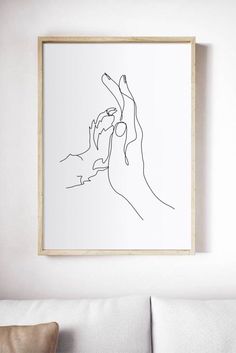 a black and white line drawing of two hands reaching for something in the air above a couch