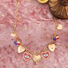 Immerse yourself in the eccentric charm of the Heart Evil Eye Charm Necklace, a standout piece from our "Powerful and Unconstrained Style" collection, straight out of a scene from a whimsical period piece. Picture this: an exquisite heart-shaped pendant, rendered in 18K gold-plated brass, is adorned with a bewitching evil eye motif. The necklace is meticulously detailed with a cascade of dripping oil and a sprinkling of cubic zirconia, adding a dash of cinematic sparkle. This charm necklace is n Symbolic Gold Heart-shaped Necklaces, Heart-shaped Dangling Charms Jewelry For Valentine's Day, Heart-shaped Jewelry With Dangling Charms For Valentine's Day, Valentine's Day Dangling Charms Necklaces, Valentine's Day Dangle Necklaces With Charms, Valentine's Day Necklace With Dangling Charms, Valentine's Day Symbolic Heart-shaped Jewelry, Gold Necklaces With Dangling Charms For Valentine's Day, Valentine's Day Symbolic Necklaces With Heart Pendant