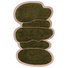 three green rugs stacked on top of each other in front of a white background