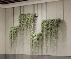 ivy growing on the side of a wall in an office building, with water running down it