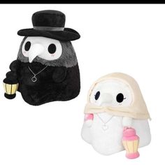 two stuffed animals one with a black hat and the other white