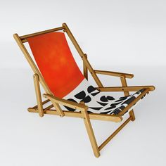 a wooden chair with a black and white patterned seat cover on it's back