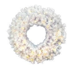 a white wreath with lights hanging from it