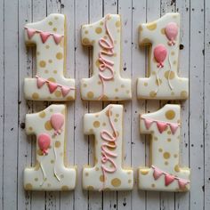 decorated cookies are arranged in the shape of numbers one, two, three and four