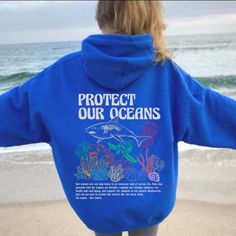 Stay stylish while supporting marine conservation with our Protect Our Oceans Hoodie featuring a striking shark design.  Perfect for marine biologists, surfers, and ocean lovers, this hoodie not only showcases your passion but also contributes to saving the ocean.  Respect the locals and make a statement with this eco-friendly and comfortable hoodie, an ideal gift for any shark enthusiast. This unisex heavy blend hooded sweatshirt is relaxation itself.  Made with a thick blend of cotton and poly Saving The Ocean, Respect The Locals, Save The Ocean, Shark Design, Shark Hoodie, Shark Gifts, Shark Lover, Marine Conservation, Beach Shirts