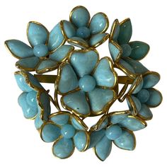 Chanel Vintage '90s Turquoise Floral Brooch Made In: France Year of Production: Circa 1990s Color: Turquoise and gold Materials: Poured glass and metal Hallmarks: CHANEL MADE IN FRANCE Closure/Opening: Pin back Overall Condition: Very good vintage condition. Small crack to one of flower petal and small black mark to center flower petal (see last two photos). Measurements: Length: 3" Height: 2.75" Depth: approximately .5" Vintage Chanel Jewelry, Chanel Flower, All Things, Chanel Brooch, Valentino Couture, Turquoise And Gold, Spring Mood, Floral Brooch, Jewelry Boards