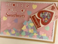 a candy bar sign with hearts and confetti in the background that says, high 3 is full of sweethearts