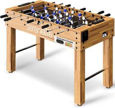 a wooden foosball table with soccer players on it and the words seattle written in white