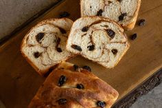 slices of bread with raisins on a cutting board