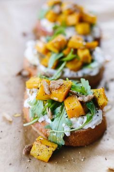 three breads with different types of food on them