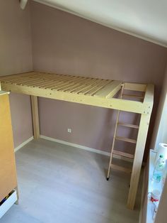 a bunk bed sitting in the corner of a room