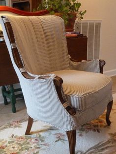 a striped chair sitting on top of a rug