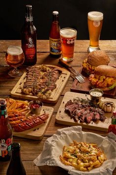 a table topped with lots of different types of food and drinks next to each other