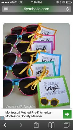 several pairs of sunglasses with tags attached to them