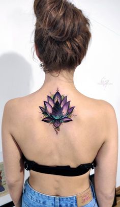 a woman with a tattoo on her back