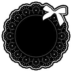 a black and white image of a doily with a bow on it's side