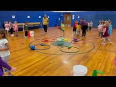 young children are playing with toys in an indoor gym