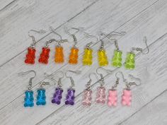 Add some fun to your jewelry collection with these cute earrings. Made with stainless steel hooks and silicone backings, these earrings are safe for sensitive skin. Free shipping on all orders over $35 Browse the rest of my shop here: https://www.etsy.com/shop/laceycakesnc Gummy Bear Earrings Outfit, Gummy Bear Beaded Necklace, Gummy Bear Necklace, Gummy Bear Accessories, Gummy Bears Earrings, Gummy Bears, Etsy Earrings Dangle, Cute Earrings, Sensitive Skin