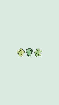 three little green teddy bears sitting next to each other on a light blue wallpaper