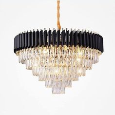 a black and gold chandelier hanging from a ceiling fixture with clear crystal drops