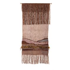 a wall hanging with different colors and fringes on the bottom, along with other items