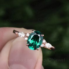 "This is a 1.3 carat Lab treated emerald engagement ring in solid gold,about 6x8mm oval cut,forever classic quality. The accent stones are round 1.5mm and marquise 2x4mm moissanites, It can be made in any ring size. However please contact me to custom make it to a special big or small size. It can be made in white gold,rose gold or yellow gold with 14k or 18k. However for some people who are nickel allergic,I can also make it to 925 sterling silver to make you can wear it. The ring is handmade,v Emerald Ring Oval, Oval Cut Emerald Engagement Ring, Emerald Jewelry With Marquise Cut Center Stone, Oval Emerald Rose Gold Jewelry, Marquise Cut Emerald Jewelry In White Gold, Oval Green Moissanite Jewelry, Marquise Cut Emerald Jewelry With Prong Setting, Emerald Jewelry Marquise Cut For May Birthstone, Marquise Cut Emerald Jewelry For May Birthstone